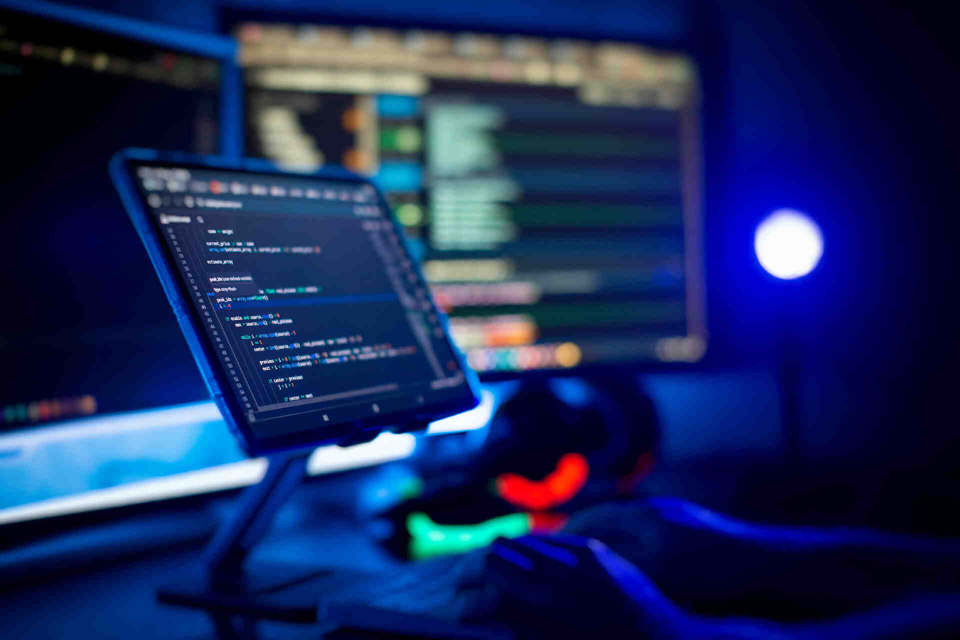 Software developers writing code for secure IT and cybersecurity services