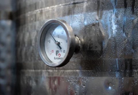 Bimetal dial thermometer on a stainless-steel process tank