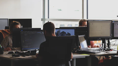Security team watching systems at their workstations