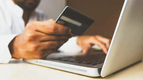Paying online with a card on a laptop