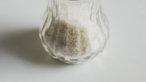 Glass salt shaker with fine edible salt