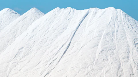 White industrial salt mounds