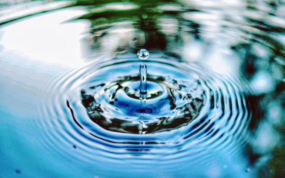 Drop falling into clear water