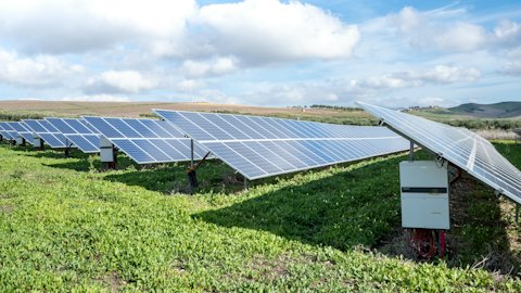 Ground-mounted solar array with inverter